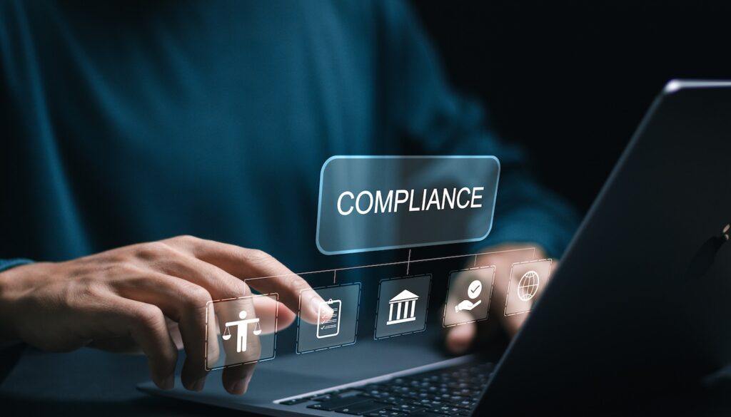 Person using computer with Compliance overlay of digital industries