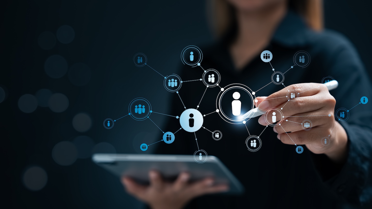 Digital overlay of staffing personnel with woman using an ipad